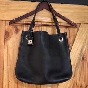 Dooney  & Bourke Black Leather Tote Bag
The liner hand tag is pelling